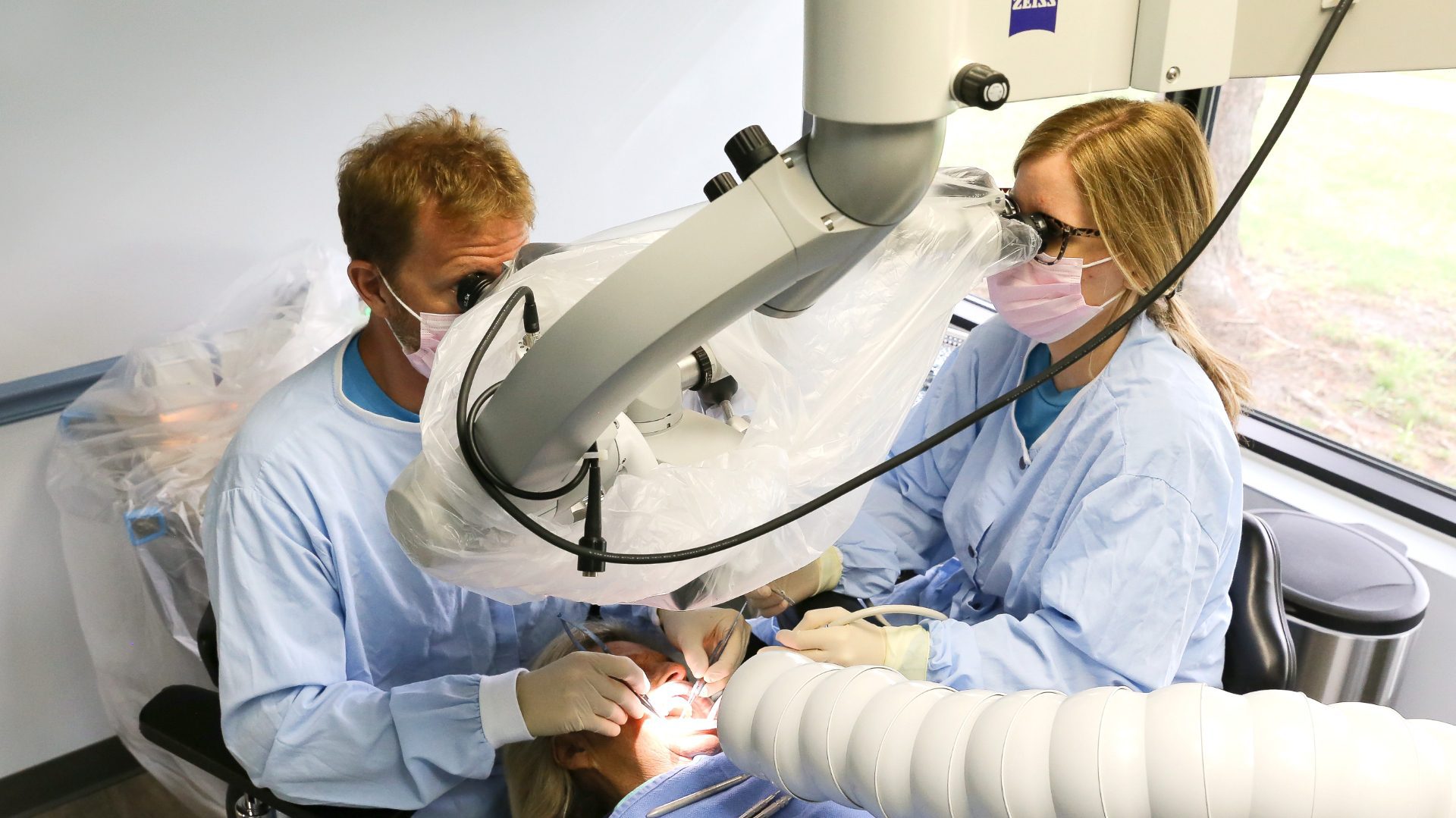 Dr. Cross examines a patient for dental implant placement.